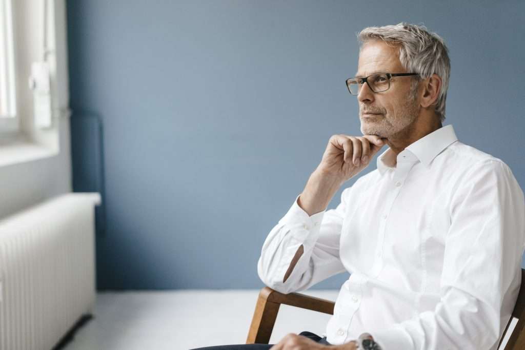 Manager sitting in chair in his office