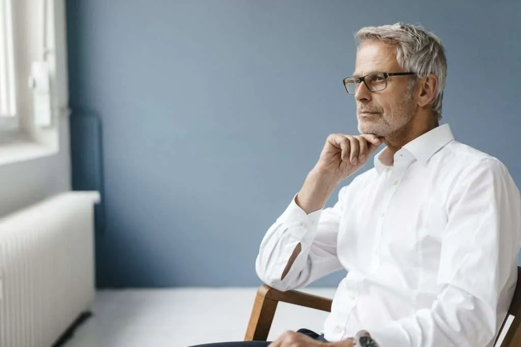 Manager sitting in chair in his office