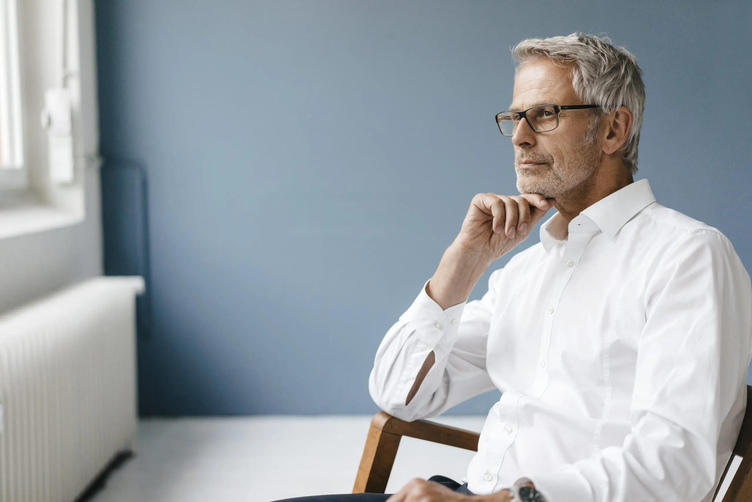 Manager sitting in chair in his office